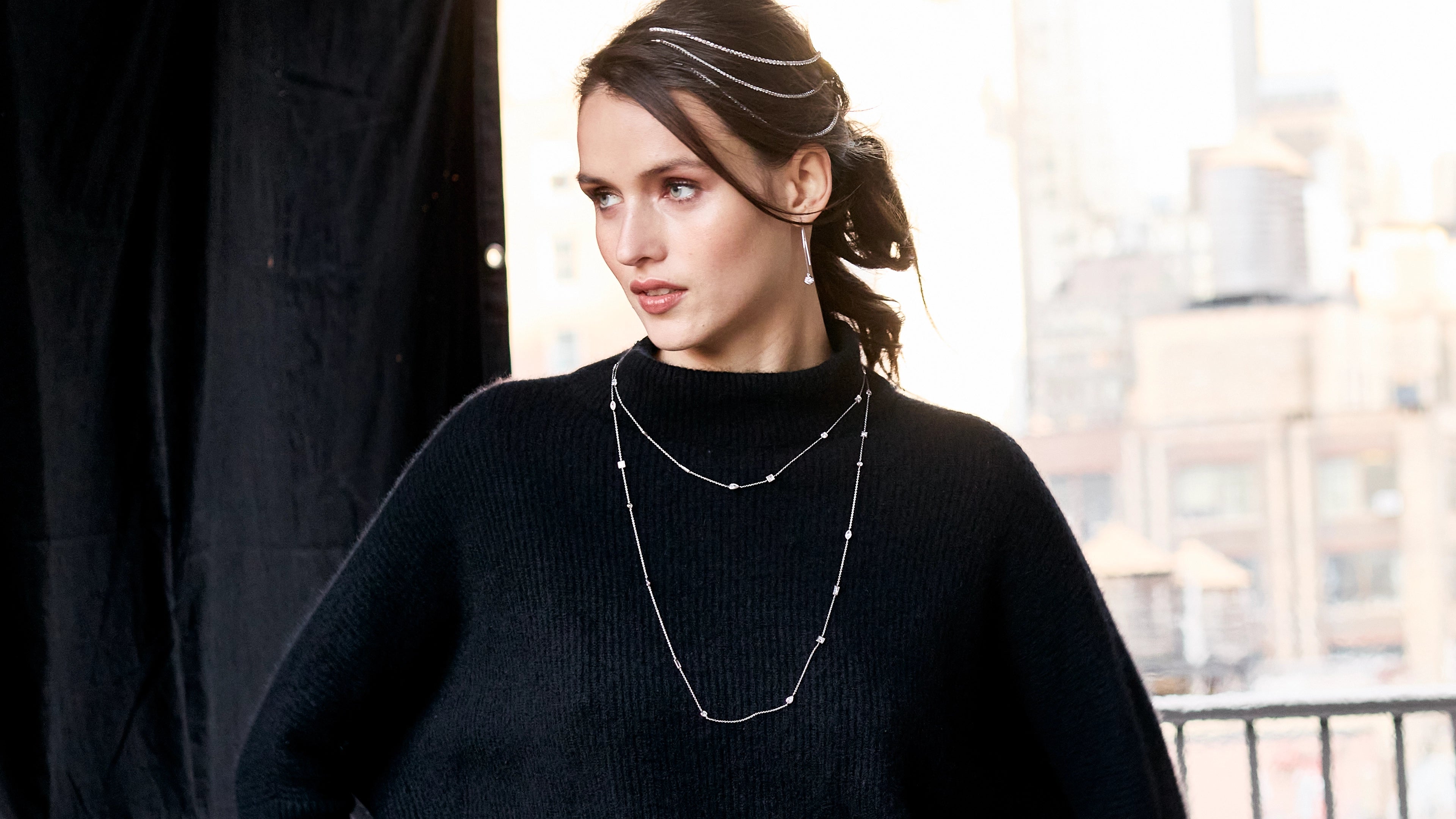 Model wearing Jevar diamond bracelets styled as a headpiece and long layered J'evar lotus petals diamond by the yard necklaces.