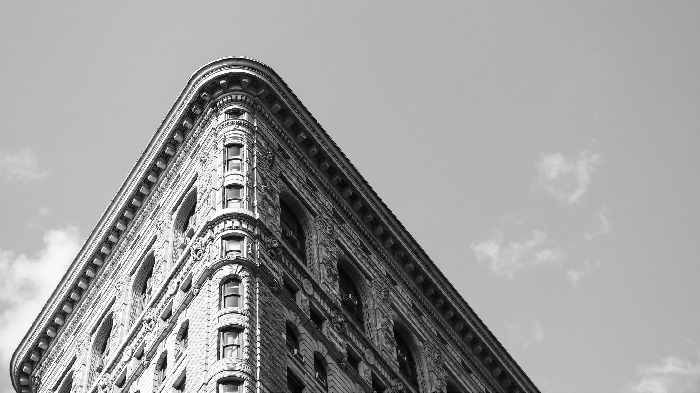 Architectural view of a historic New York City skyscraper against a clear sky, representing the NYC heritage of ALTR Created Diamonds. This banner serves as the gateway to latest news, industry disruption updates, and innovations in the lab-grown diamond sector.