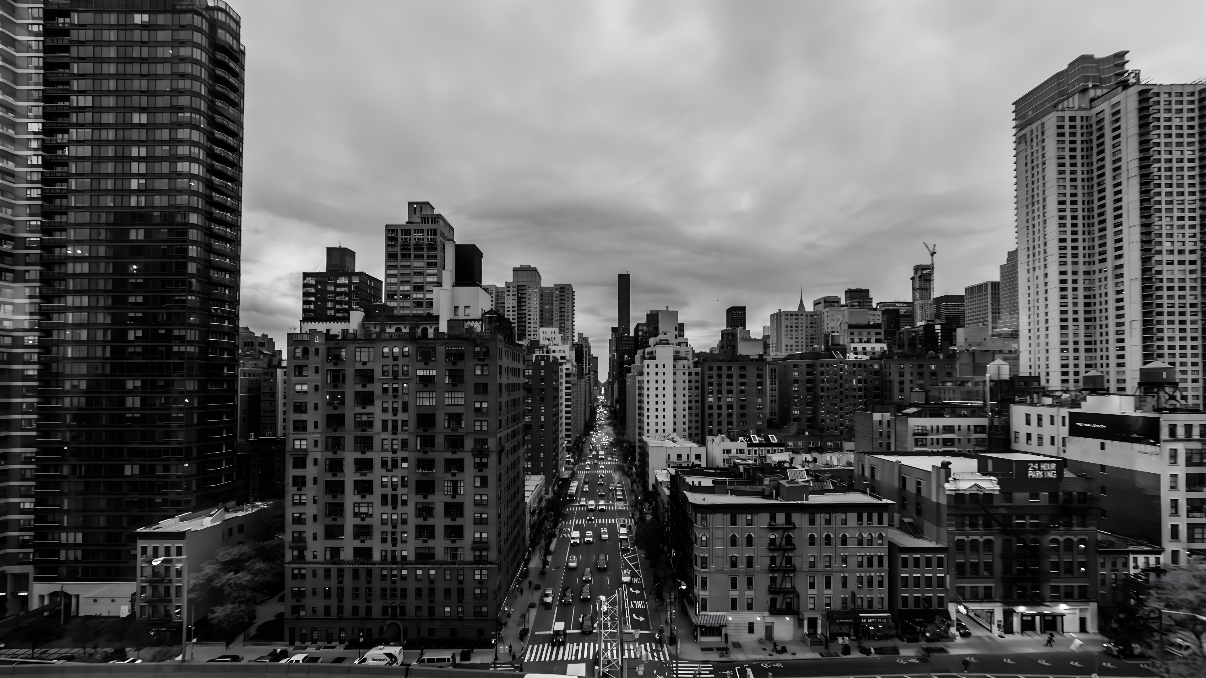 A black and white high-angle view of a busy New York City street flanked by skyscrapers. Representing the urban energy and 47th Street roots of ALTR Created Diamonds, this banner invites users to subscribe for exclusive updates on sustainable luxury and diamond technology.