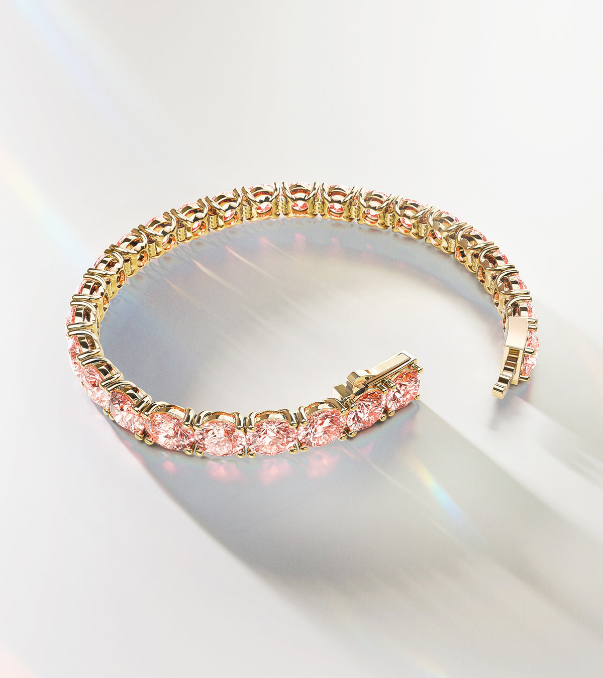 Luxury ALTR Created Diamonds tennis bracelet featuring round-cut pink lab-grown diamonds set in 14k yellow gold, displayed with elegant light reflections.