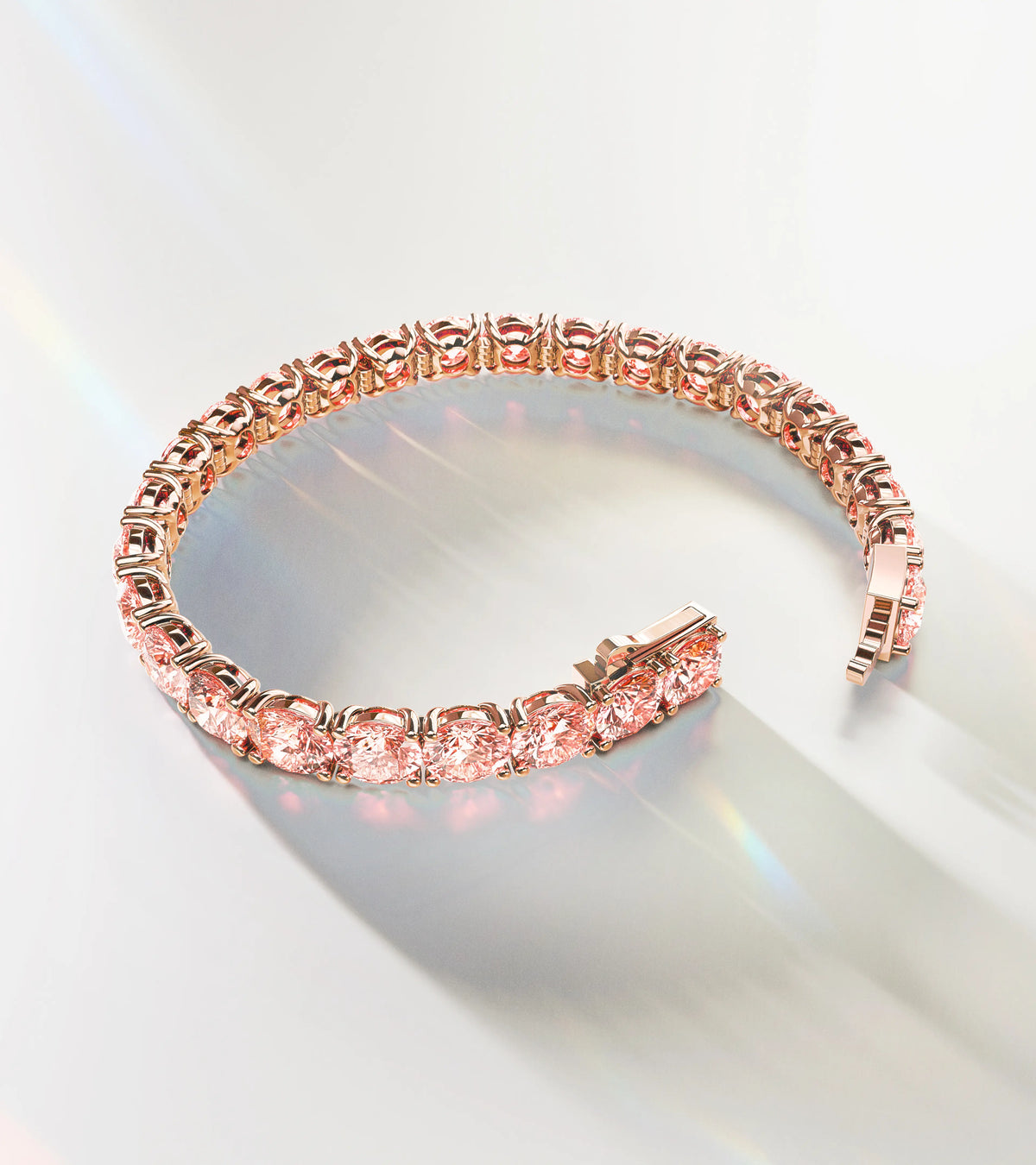 Luxury ALTR Created Diamonds tennis bracelet featuring round-cut pink lab-grown diamonds set in 14k rose gold, displayed with elegant light reflections.