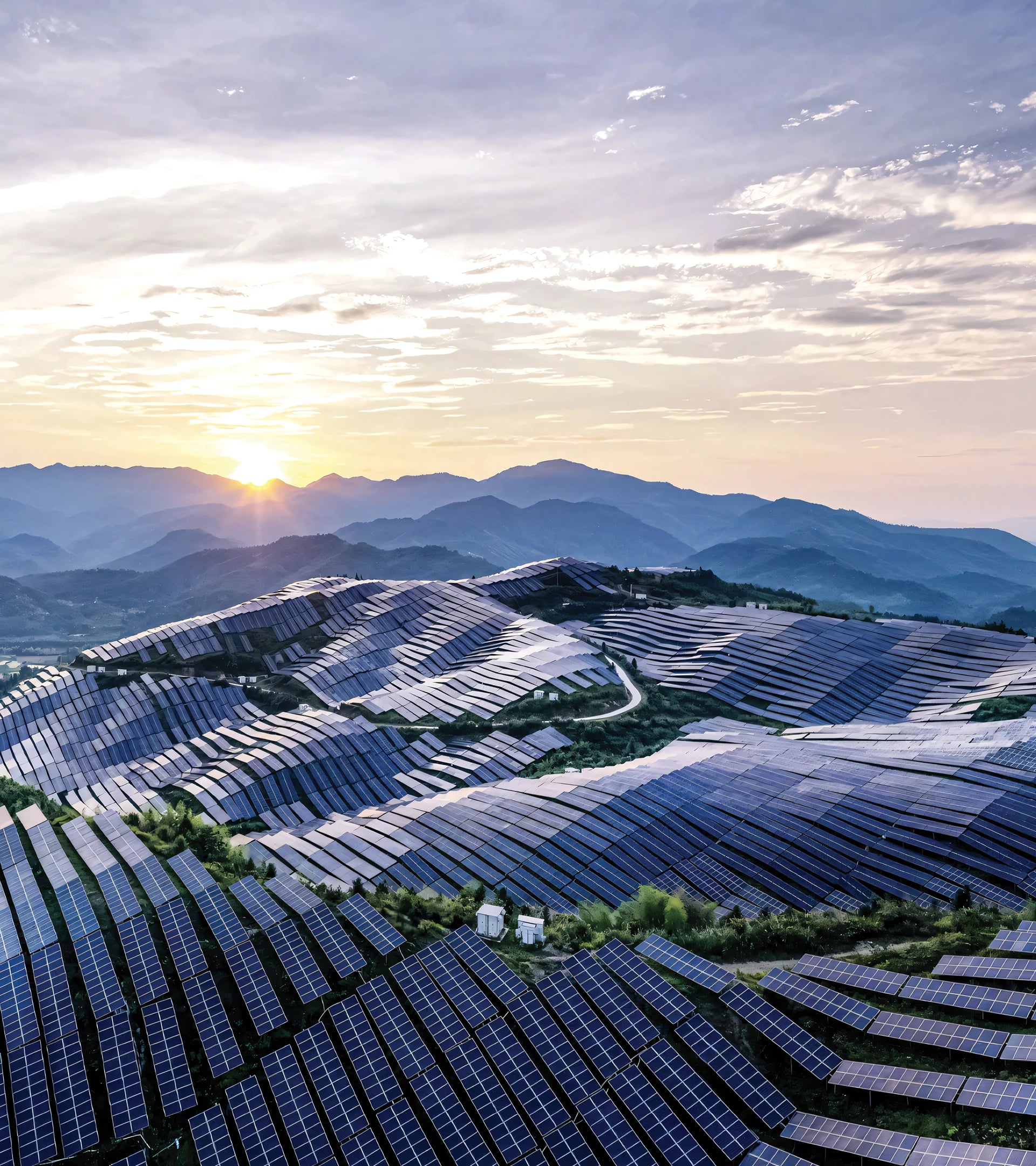 Aerial view of a massive solar energy farm in the mountains, highlighting ALTR's sustainable diamond growth.