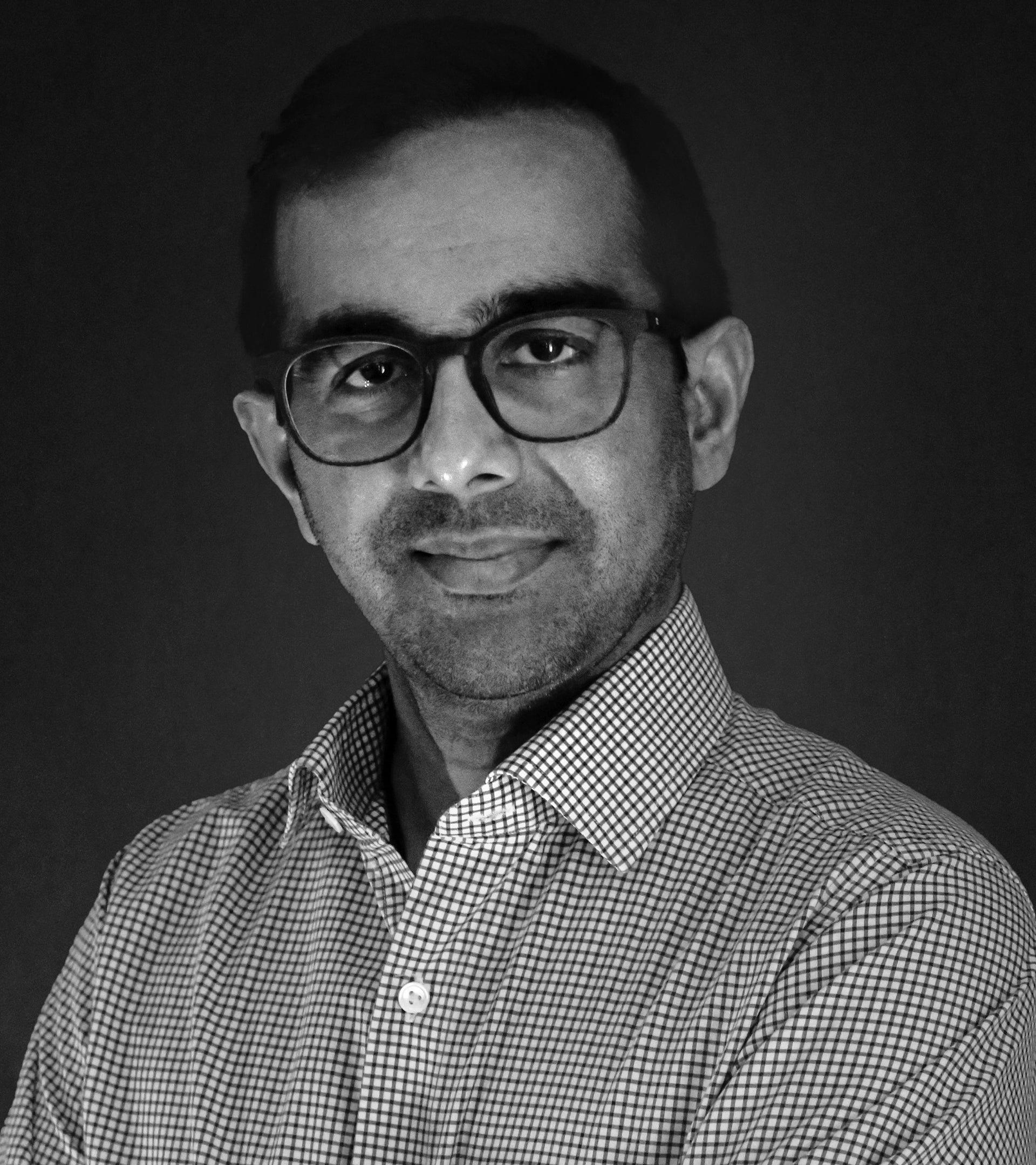 A black and white professional portrait of Ritesh Shah, Founder and CEO of ALTR Created Diamonds. This image represents ALTR Heritage, highlighting the leadership and visionary expertise behind the brand’s pioneering role in the Type IIa lab-grown diamond industry.