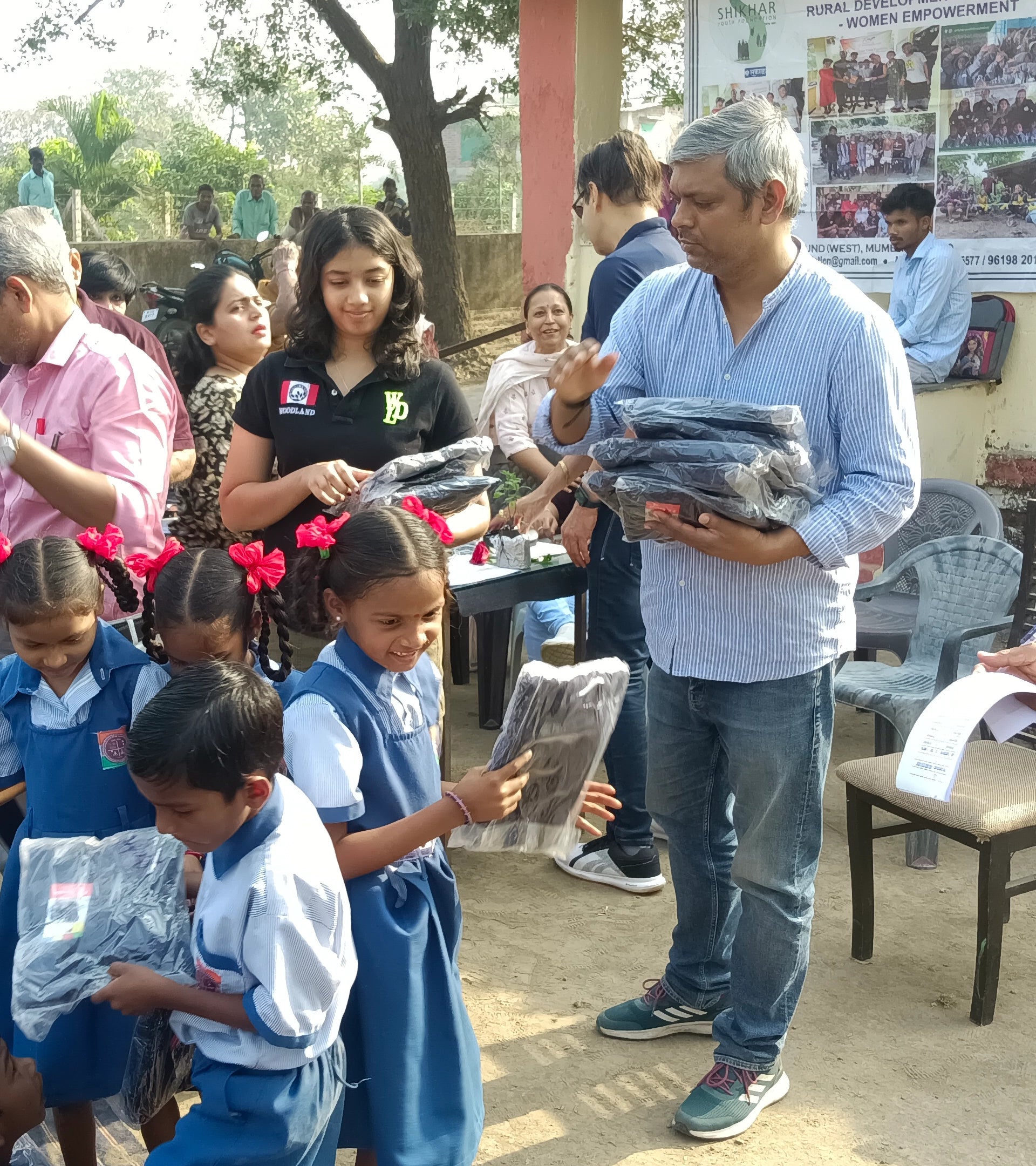 ALTR distributing supplies to school children as part of a rural empowerment initiative to encourage sustainable development for the future generations