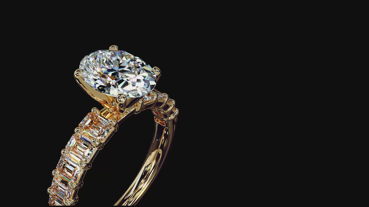 Close-up video of an ALTR Created Diamonds oval brilliant-cut diamond solitaire ring. The film showcases the elongated symmetry of the lab-grown oval diamond and its brilliant-cut faceting that maximizes light performance. Set in a specialized 18K yellow gold crown mounting, the camera pans to highlight the polished gold shank and intricate prongs, emphasizing the contrast between the rich gold and the colorless Type IIa diamond.